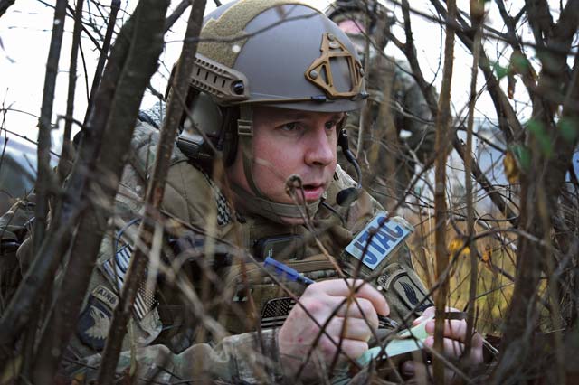 Photo by Senior Airman Matthew LotzTech. Sgt. Andrew Carpenter, 2nd Air Support Operations Squadron joint tactical air controller, writes down coordinates of a simulated target Dec. 2, 2014, in Barcis, Italy. During a week-long exercise near Aviano Air Base, Italy, U.S. and Dutch military trained with 555th Fighter Squadron pilots to stay current in their proficiencies.