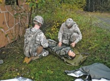 Soldiers from the 10th Army Air and Missile Defense Command prepare a mock casualty for transport during a training exercise Oct. 18 on Rhine Ordnance Barracks.