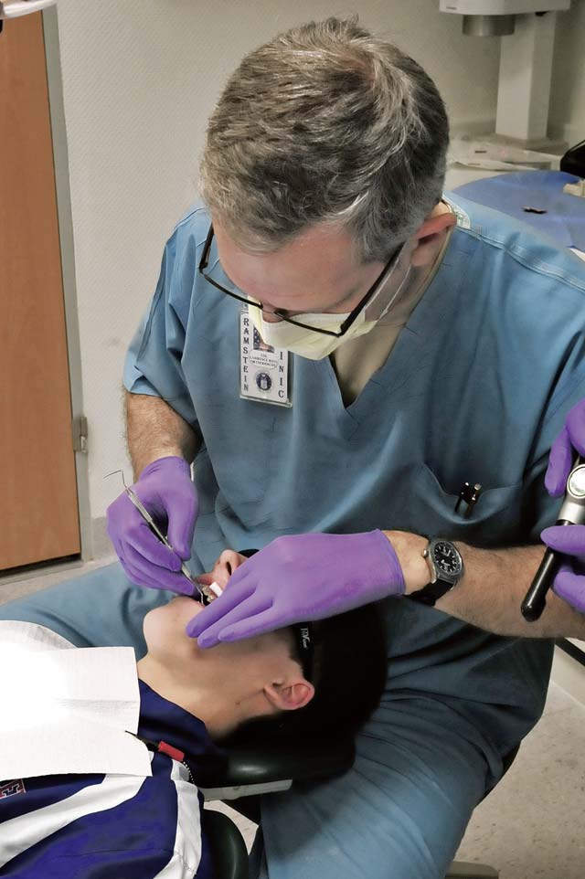 Col. Lawrence Roth, 86th Dental Squadron orthodontist, conducts orthodontic procedures, such as cleaning and tightening a patient’s braces, Jan. 15 on Ramstein.