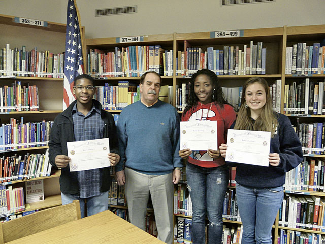 Courtesy photo‘Why I’m optimistic about our nation’s future’Ramstein High School sophomores Amethyst Rorie, Myles Davis and Emily Sinkular pose for a photo with principal Greg Hatch after taking the top three places in the local Voice of Democracy Contest, which is sponsored every year by the VFW. This year’s theme was: “Why I’m optimistic about our nation’s future.” The students will move on to the next round of competition in hopes of winning the prize of $30,000 in scholarships.