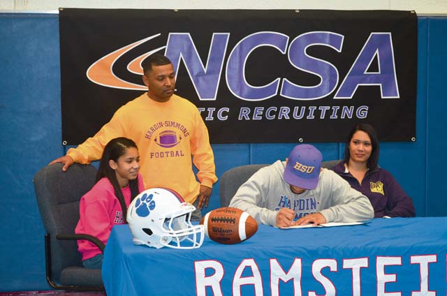Courtesy photoRamstein High School senior Robert Navarro Jr. signs a letter of intent Feb. 7 to play college football at Hardin-Simmons University in Abilene, Texas, where he plans to pursue a degree in athletic training.