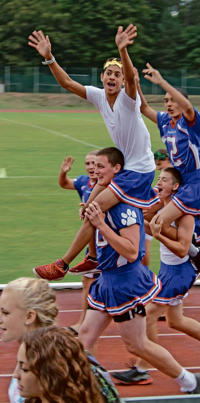 Photo by Ashley MarshallCelebrating victoryRamstein High School seniors Jay Lee Sykes and Joey Bahret celebrate their powerpuff team’s victory. During the powderpuff games, the roles are reversed; the girls play football while the boys cheer the girls on.
