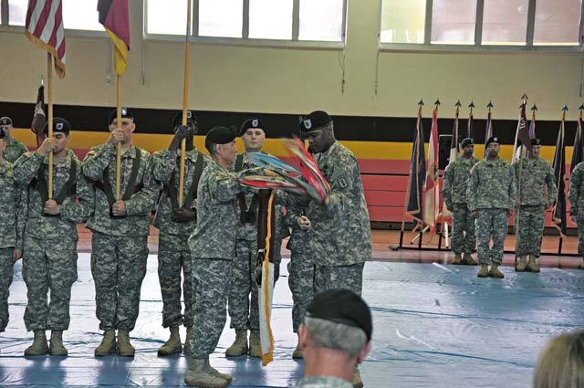 Photo by Sgt. 1st Class David LoweSoldiers from the 30th Medical Command furl their unit colors during a recent ceremony at U.S. Army Garrison Rheinland-Pfalz.