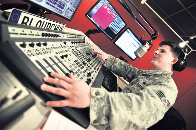 Photo by Senior Airman Aaron-Forrest WainwrightSenior Airman Shane Mitchell, American Forces Network Kaiserslautern radio disc jockey, plays the latest hits over the radio Sept. 6 on Vogelweh. AFN Kaiserslautern is celebrating 70 years of service to the KMC this year.