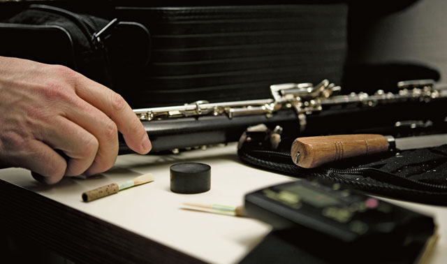 Staff Sgt. Justin Hummer, U.S. Air Forces in Europe and Air Forces Africa Band oboe player, prepares his instrument for the KMC Holiday Concert. The concert is an annual tradition for the USAFE Band and is open to the public.  