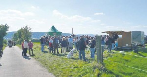 Hikers stop at several food and beverage stations during the spring culinary hike Saturday in Wolfstein.