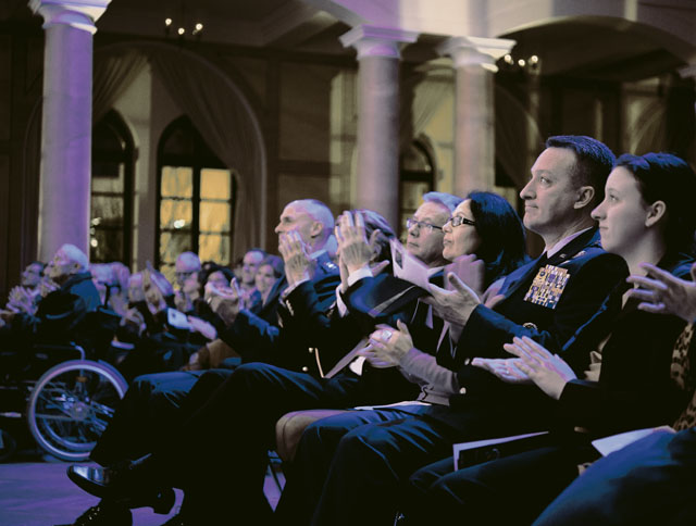 Concert attendees applaud the U.S. Air Forces in Europe and Air Forces Africa Band and Rheinland-Pfalz International Choir during the KMC Holiday Concert.  