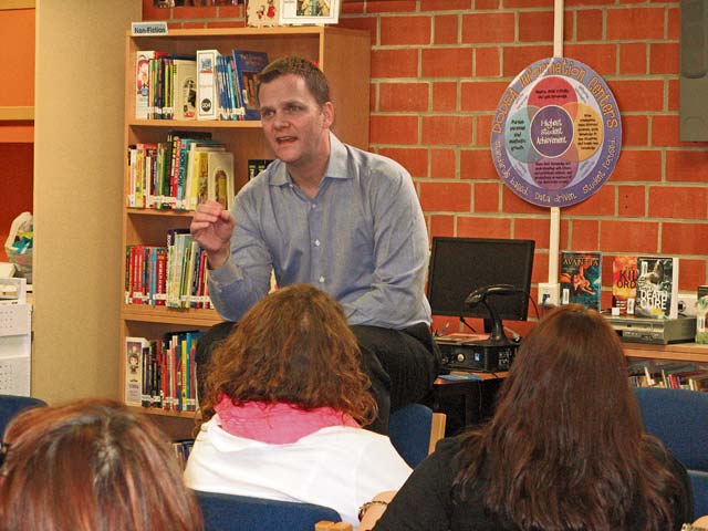 Courtesy photoVisiting slam poet and humorist Taylor Mali spends time with Landstuhl Elementary/Middle School students recently. In addition to class poetry sessions, he entertained educators with an afterschool workshop.