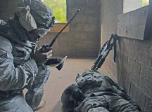 Staff Sgt. Tony Pettway, 355th Security Forces Squadron creek defender course trainee, calls in a medical evacuation for Airman 1st Class Jose Ramos, 355th SFS creek defender course trainee, during building clearance training Oct. 17.
