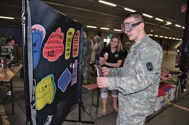 Photo by Dijon RolleArmy Safety DayPfc. Daniel Martiniuc tests his coordination while participating in a demonstration at the Army Substance Abuse Program table. The table was one of several set up in support of the garrison’s annual Safety Day event May 21 at the Rhine Ordnance Barracks Special Events Center. The event is designed to promote overall safety awareness and provide additional training opportunities for service members, civilians and families.