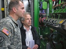 Lt. Col. Lars Zetterstrom, U.S. Army Garrison Kaiserslautern commander, and Werner Holz, mayor of the Union Community Bruchmühlbach-Miesau, watch the operation of a new methane-powered heating plant.