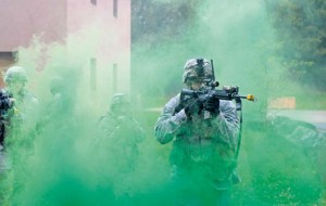 Staff Sgt. Jon-Paul Horning, 86th Security Forces Squadron creek defender course trainee, advances through a smoke grenade during building clearance training Oct. 17.