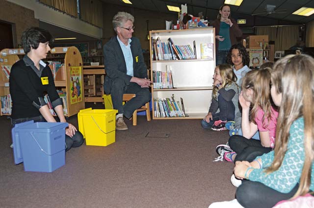 Ewa Kondek (left) and Frank Schork (right), from the garrison’s Directorate of Public Works, speak with children from Sembach Elementary School during an Earth Day celebration April 22.