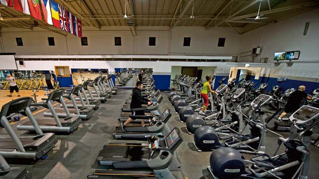 Service members use cardio machines at the Ramstein Northside Fitness Center Jan. 16. The fitness center recently implemented new hours, allowing people to get a late-night workout.