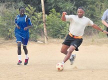 Photo by Sgt. 1st Class Alexander BurnettU.S. Army Capt. Rocky Robinson, 21st Theater Sustainment Command Regional Support Element-United Assistance human resources officer in charge, tries to keep the soccer ball away from his Senegalese opponent during a soccer game Nov. 25 at Camp Cisse.