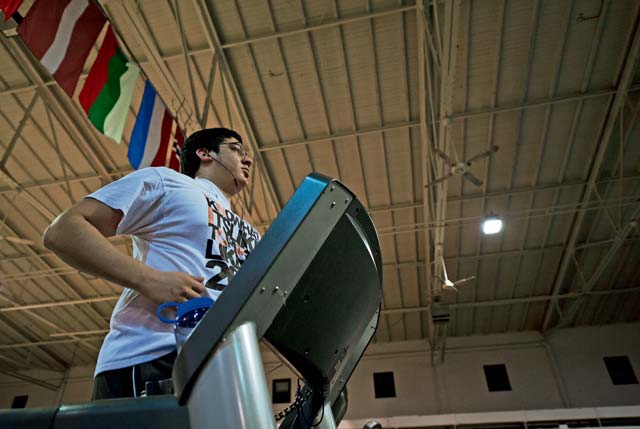 Military dependent Michael Flores runs on a treadmill at the Ramstein Northside Fitness Center during its new operational hours Jan. 21. The fitness center is available to all government ID cardholders.