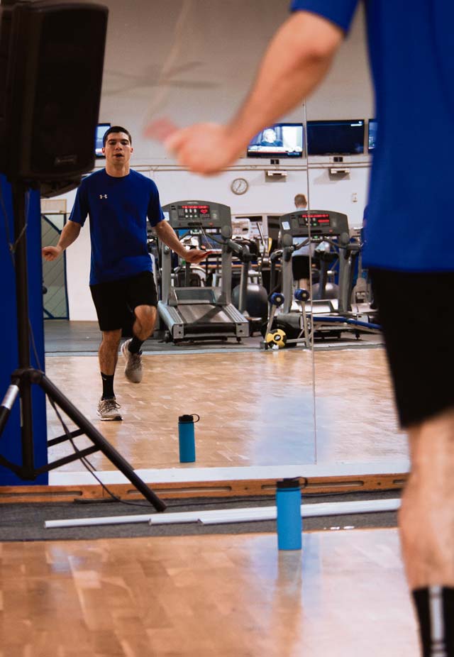 Airman 1st Class Carlos Palomino, 24th Intelligence Squadron geospatial intelligence analyst, works out at the Ramstein Northside Fitness Center Jan. 21. People can use equipment in the main fitness lobby, including resistance weight equipment, cardio machines and free weights.