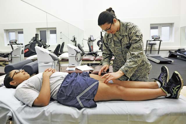 Airman 1st Class Jannett Blaess, 86th Medical Operations Squadron physical therapy technician, applies electric therapy for muscle contraction promotion to Senior Airman Chardonnay Taylor, 1st Air and Space Communication Operations Squadron systems operator, Jan. 16 on Ramstein. The 86th MDOS physical therapy section is available to lend a hand when it comes to helping patients alleviate pain and regain their physical abilities. 