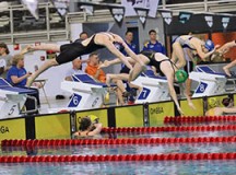Photo by Nathan Davis
Kaiserslautern Kingfish swimmer Lexy Meints jumps off the blocks in the 200-meter freestyle, in which she set a new team record.