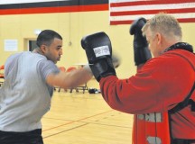 Staff Sgt. David Meredith, 721st Aerial Port Squadron security manager, spars against James Scullion, Celtic Warrior Boxing Club coach, during practice Feb. 27 at the Miesau Army Depot. The combination of cardio, cross training and strength training makes boxing a great alternate workout for any fitness level.