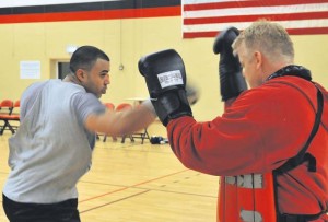 Staff Sgt. David Meredith, 721st Aerial Port Squadron security manager, spars against James Scullion, Celtic Warrior Boxing Club coach, during practice Feb. 27 at the Miesau Army Depot. The combination of cardio, cross training and strength training makes boxing a great alternate workout for any fitness level.