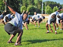 Staff Sgt. Juna C. Cyriaque, personnel NCO assigned to the 
21st Theater Sustainment Command’s Special Troops 
Battalion, leads her class in performing “The Windmill” during Physical Readiness Training as a part of the Master Fitness Trainer course June 24 on Vogelweh.