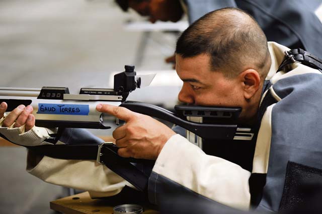 Photo by Desiree Palacios Tech. Sgt. Alex Gaud-Torres checks out his target during the Warrior Games training camp held in Colorado Springs, Colo., Apr. 16. Gaud-Torres resides at Beale Air Force Base, Calif. 