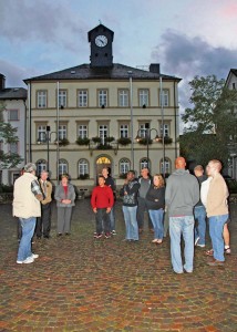Baumholder Assistant City Mayor Michael Röhrig (left) welcomes several members of Baumholder’s Better Opportunities for Single Service Members and German guests to a tour of the old city hall and museum. In the background is the old city hall where dozens of historical displays are currently housed.