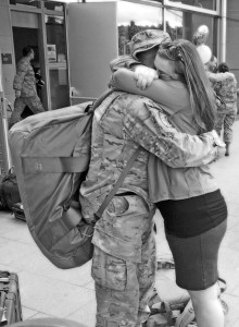 Courtesy photoSenior Airman Chris Willis is greeted by his wife, Rena, after returning home from a six-month deployment to Afghanistan May 15, 2013.