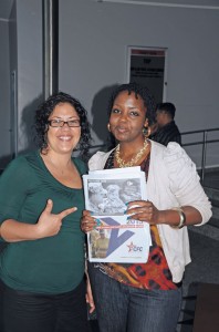 Photo by Capt. Kyle McKemyU.S. Army Garrison Kaiserslautern Combined Federal Campaign-Overseas representative Gina Hranilovic (left) poses with newly trained representative Dijon Rolle as Rolle picks up her first box of campaign supplies during a training session Sept. 3 at Galaxy Theater.