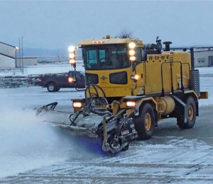 Courtesy photoThe 786th Civil Engineer Squadron snow removal team removes snow on a parking apron during the 2012-2013 snow season.