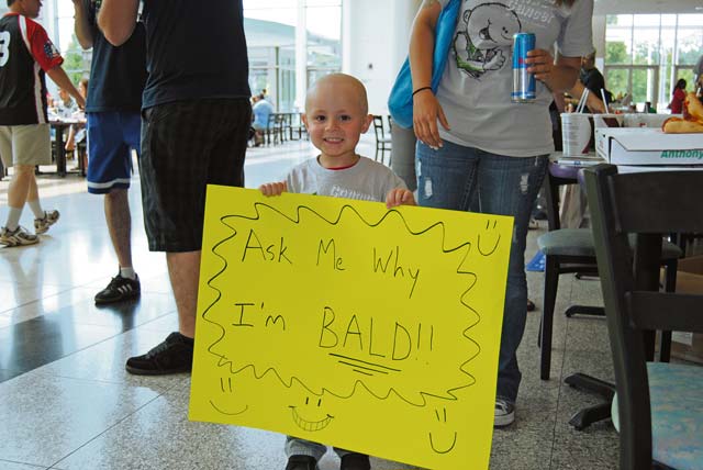 Photos by Airman Dymekre AllenThe St. Baldrick’s foundation conducted the fourth annual “Shave your head for childhood cancer” event June 30 at the Kaiserslautern Military Community Center on Ramstein. The foundation hosted a volunteer charity event in which 117 military members, civilians and dependents in the KMC sheared their locks in support of raising awareness and money to bring hope to infants, children, teens and young adults fighting the war on cancer. The St. Baldrick’s head-shaving events began as a challenge between businessmen and has grown from one event in 2000 to more than 1,290 events in 2012. This year’s event rose 11,500 in donations, surpassing the goal of 10,000. Team PMEL was the largest contributor by donating more than 4,500 for the charity event.