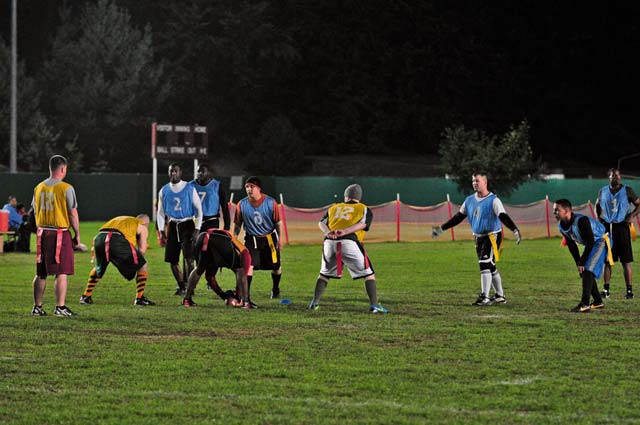 Photo by Spc. Iesha HowardSoldiers with the 21st Theater Sustainment Command prepare for the snap during an intramural flag football game against the 95 Military Police Battalion Oct. 2 on Daenner Kaserne in Kaiserslautern. The 95th MP Bn. defeated the 21st TSC 21-0 in the playoff game to advance to the next bracket. 