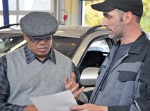 Photo by Elizabeth BehringDanny Sneed (right), a wreck assistant at Pulaski Auto Skills, goes over Andres J. Martinez Javier’s worksheet after performing a free check on Javier’s car Oct. 25 during U.S. Army Garrison Rheinland-Pfalz’s biannual Vehicle Inspection Day. Javier works at the U.S. Army Medical Materiel Center, Europe, in Pirmasens. Sneed said the two most common errors he sees during auto checks are over-inflated tires, which can wear out quickly and be dangerous, and customers who don’t get their oil routinely changed.