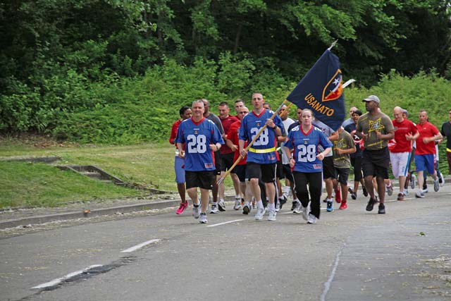 Photo by Sgt. 1st Class John S. WollastonU.S. Army NATO Brigade Commander Col. Robert Larsen (left) and U.S. Army NATO Brigade Command Sgt. Maj. Joanne Cox (right) lead Soldiers from the brigade on a Spiritual Fitness/Independence Day run. The Unit Ministry Team from U.S. Army NATO Brigade organized the run for the units stationed on Sembach. In  addition to the NATO Brigade, Soldiers from the European Regional Medical Command, 30th Medical Command, 95th Military Police Battalion and the 230th Military Police Company participated in the event.