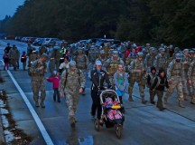 Photo by Airman 1st Class Michael StuartApproximately 75 members of the 435th Contingency Response Group conduct a 5-kilometer weighted-ruck march Oct. 11 on Ramstein. The squadron rucks every Friday morning, year-round, but this was the first time family members accompanied the Airmen. Family members were able to experience what the 435th CRG endures to ensure readiness. Air Force fitness is essential to mission readiness, and this march helps Airmen get physically prepared for a deployed environment.