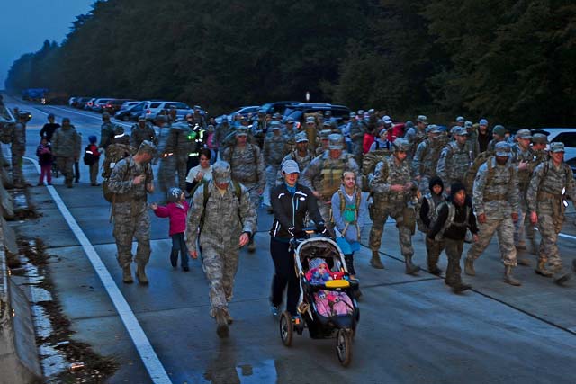 Photo by Airman 1st Class Michael StuartApproximately 75 members of the 435th Contingency Response Group conduct a 5-kilometer weighted-ruck march Oct. 11 on Ramstein. The squadron rucks every Friday morning, year-round, but this was the first time family members accompanied the Airmen. Family members were able to experience what the 435th CRG endures to ensure readiness. Air Force fitness is essential to mission readiness, and this march helps Airmen get physically prepared for a deployed environment.