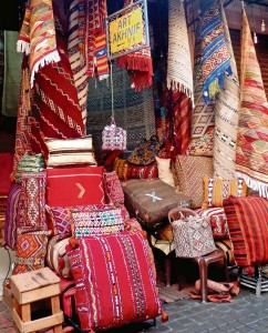 A shop displays traditional rugs, carpets and pillows in a market in the Medina April 1 in Marrakesh. Textiles are hand woven by tribes indigenous to different parts of Morocco and sold in Marrakesh.