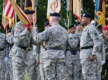 Lt. Gen. Donald M. Campbell Jr., commanding general of U.S. Army Europe, passes the colors of the 21st Theater Sustainment Command to Maj. Gen. John R. O’Connor, the new commanding general of the 21st TSC, during a change of command ceremony June 28 at Daenner Kaserne.