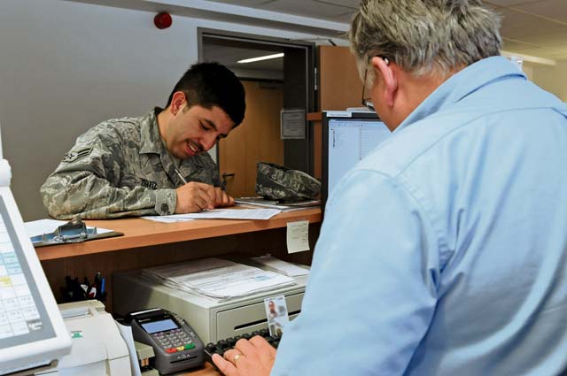 Photo by Airman 1st Class Holly MansfieldCharles Pittenturf, 86th Force Support Squadron value added tax clerk, helps Airman 1st Class Michael Ortiz, 86th Comptroller Squadron customer service technician, complete a VAT form Aug. 29 on Ramstein. The VAT office provides tax relief opportunities for members and their families stationed in Germany. 