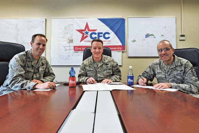 Photo by Senior Airman Aaron-Forrest WainwrightBrig. Gen. Patrick X. Mordente (center), 86th Airlift Wing commander, Col. Leslie Smith (left), 86th AW vice commander, and Chief Master Sgt. James Morris (right), 86th AW command chief, pose for a photo before donating to the Combined Federal Campaign Sept. 18 on Ramstein. The mission of the CFC is to promote and support philanthropy through a program that is employee focused, cost-efficient and effective in providing all federal employees the opportunity to improve their quality of life.