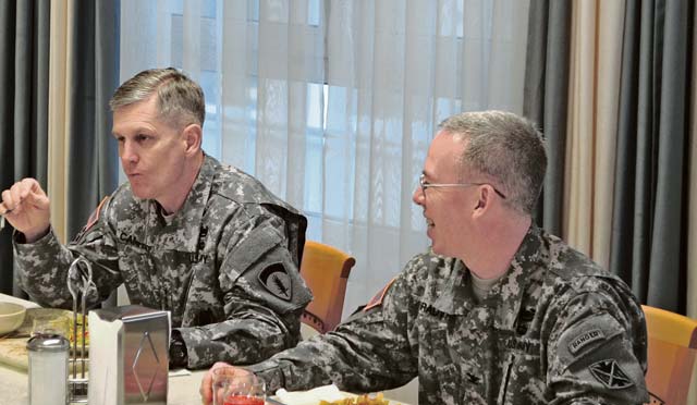 Photo by Staff Sgt. John ZumerLt. Gen. Donald M. Campbell (left), U.S. Army Europe commanding general, Col. Gregory Brady, 10th Army Air and Missile Defense Command commander, listen to a question posed by a 10th AAMDC Soldier during a leaders’ luncheon Feb. 6 in Kaiserslautern.
