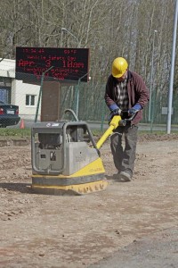 A construction worker begins groundwork that will permanently repair one kilometer of the damaged Pulaski Road March 27 in Kaiserslautern.