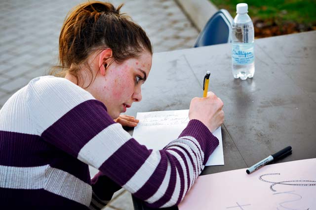 Ramstein High School senior Kayla Kessel writes a letter of encouragement to members of a Covenant House in the U.S. during the Solidarity Sleep Out event April 19 on Ramstein. The sleep out was organized by the Ramstein Keystone Club and was aimed at raising awareness for the homeless.