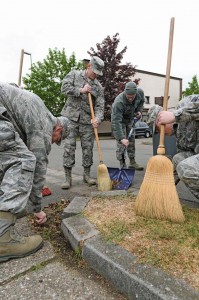 Airmen from the 86th Communications Squadron ensure the streets surrounding their squadron are spotless during Base Pride Day April 28 on Ramstein. Base Pride Day is a semiannual, two-day spring cleanup when Airmen clean where they live and work. 