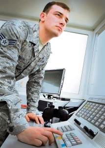Photo by Tech. Sgt. Daylena Gonzalez Senior Airman Kyle Gibson, 86th Operational Support Squadron air traffic controller, completes radio transmission adjustments during an operations check March 2 from the new alternate Air Traffic Control facility near the flightline on Ramstein.