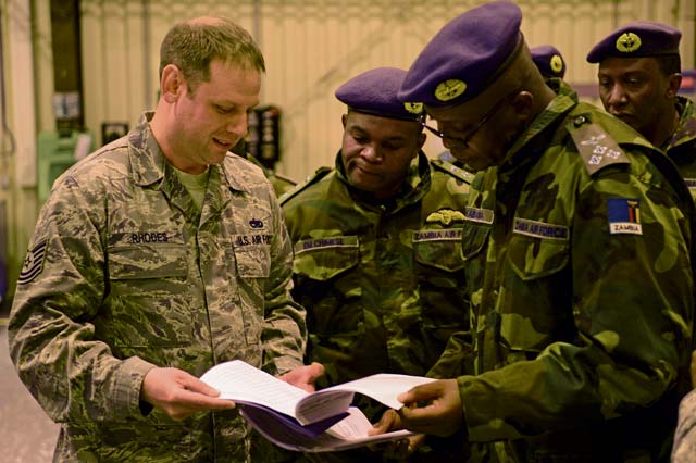 Tech. Sgt. Michael Rhodes, 86th Maintenance Squadron aircraft structural maintenance section chief, provides information to the Zambian air force on the technical training an Air Force Airman receives May 1 on Ramstein. The visit gave the Zambian air force a chance to further military relations and improve the partnership between the U.S. and Zambian air forces.