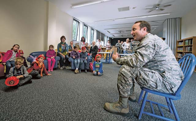 Lt. Gen. Tom Jones, U.S. Air Forces in Europe and Air Forces Africa vice commander, talks to a group of children from the Villa Winzig Kindergarten during a tour of Ramstein Air Base Oct. 2. With more than 55,000 American citizens living in the greater Kaiserslautern area, U.S. Air Force units have shared a 60-year partnership with their host nation counterparts, and since 2009, several groups of German kindergarten children have visited Ramstein to continue those relationships.  