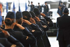 Photo by Senior Airman Chris WillisAirmen salute while the base honor guard posts the colors during the 86th Airlift Wing change of command ceremony Monday on Ramstein.