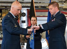 Col. Scott Warner, 86th Civil Engineer Group commander, assists Lt. Col. Robert Grover, 886th Civil Engineer Squadron commander, with retiring the flag of the 886th CES during an inactivation ceremony June 5 on Ramstein. The inactivation was necessary to reorganize and enhance efficiencies and allow the Air Force to better apply limited resources through smarter requirement prioritization.